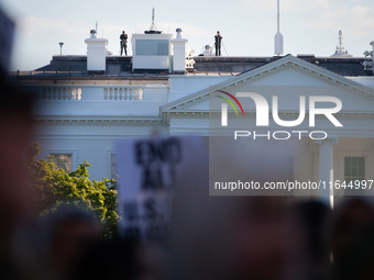 Counter-snipers patrol the White House roof during a demonstration demanding ceasefires in Palestine and Lebanon in Washington, DC, on Octob...