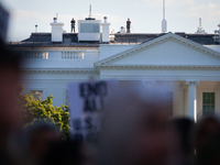 Counter-snipers patrol the White House roof during a demonstration demanding ceasefires in Palestine and Lebanon in Washington, DC, on Octob...