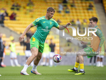 Callum Doyle of Norwich City and Kellen Fisher of Norwich City warm up before the Sky Bet Championship match between Norwich City and Hull C...