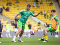 Callum Doyle of Norwich City and Kellen Fisher of Norwich City warm up before the Sky Bet Championship match between Norwich City and Hull C...