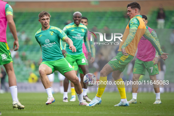 Callum Doyle of Norwich City and Ante Crnac of Norwich City warm up before the Sky Bet Championship match between Norwich City and Hull City...