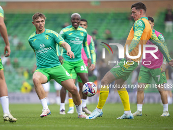 Callum Doyle of Norwich City and Ante Crnac of Norwich City warm up before the Sky Bet Championship match between Norwich City and Hull City...