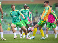 Callum Doyle of Norwich City and Ante Crnac of Norwich City warm up before the Sky Bet Championship match between Norwich City and Hull City...