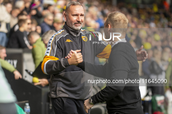 Norwich City Manager, Johannes Hoff Thorup, and Hull City Manager, Tim Walter, shake hands before the Sky Bet Championship match between Nor...