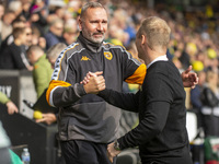 Norwich City Manager, Johannes Hoff Thorup, and Hull City Manager, Tim Walter, shake hands before the Sky Bet Championship match between Nor...