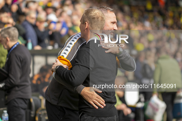 Norwich City Manager, Johannes Hoff Thorup, and Hull City Manager, Tim Walter, shake hands before the Sky Bet Championship match between Nor...