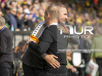 Norwich City Manager, Johannes Hoff Thorup, and Hull City Manager, Tim Walter, shake hands before the Sky Bet Championship match between Nor...