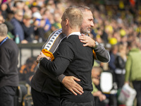 Norwich City Manager, Johannes Hoff Thorup, and Hull City Manager, Tim Walter, shake hands before the Sky Bet Championship match between Nor...