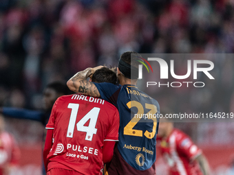 Gianluca Mancini of AS Roma and Daniel Maldini of AC Monza participate in the Serie A match between Monza and AS Roma at U-Power Stadium in...