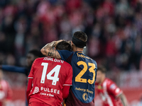 Gianluca Mancini of AS Roma and Daniel Maldini of AC Monza participate in the Serie A match between Monza and AS Roma at U-Power Stadium in...