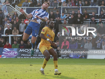 Luke Charman of Hartlepool United challenges for a header with Chinwike Okoli of Sutton United during the Vanarama National League match bet...