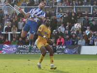 Luke Charman of Hartlepool United challenges for a header with Chinwike Okoli of Sutton United during the Vanarama National League match bet...