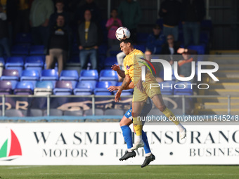 Josh Coley of Sutton United challenges David Ferguson of Hartlepool United for a header during the Vanarama National League match between Ha...