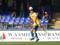 Josh Coley of Sutton United challenges David Ferguson of Hartlepool United for a header during the Vanarama National League match between Ha...