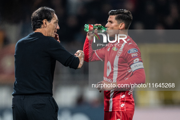 Alessandro Nesta, head coach of AC Monza, speaks with Matteo Pessina after Monza scores a goal during the Serie A match between Monza and AS...