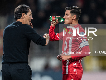 Alessandro Nesta, head coach of AC Monza, speaks with Matteo Pessina after Monza scores a goal during the Serie A match between Monza and AS...