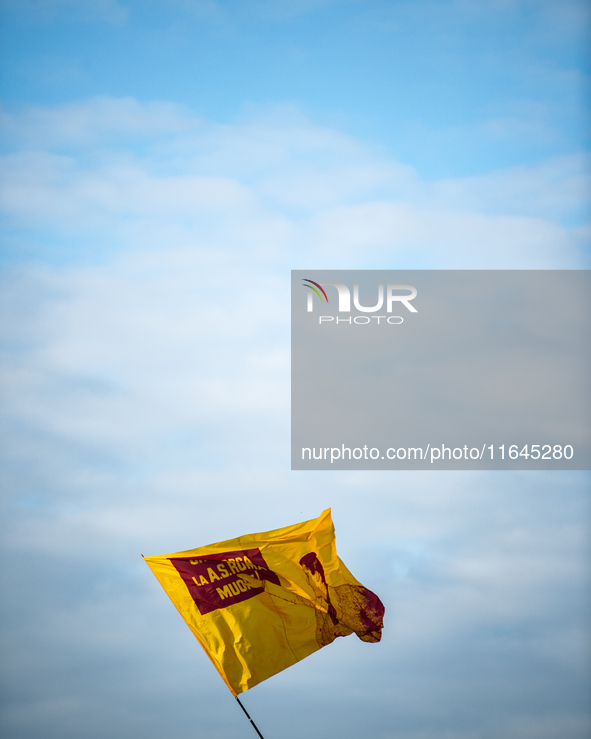 AS Roma fans wave a flag before the Serie A match between Monza and AS Roma at U-Power Stadium in Monza, Italy, on October 6, 2024. 