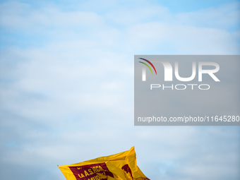 AS Roma fans wave a flag before the Serie A match between Monza and AS Roma at U-Power Stadium in Monza, Italy, on October 6, 2024. (