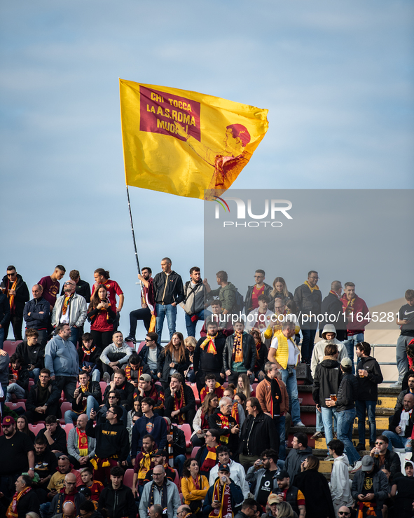 AS Roma fans wave a flag before the Serie A match between Monza and AS Roma at U-Power Stadium in Monza, Italy, on October 6, 2024. 