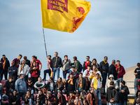 AS Roma fans wave a flag before the Serie A match between Monza and AS Roma at U-Power Stadium in Monza, Italy, on October 6, 2024. (