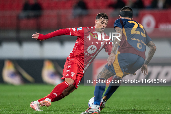 Gianluca Mancini of AS Roma and Daniel Maldini of AC Monza play during the Serie A match between Monza and AS Roma at U-Power Stadium in Mon...