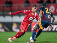 Gianluca Mancini of AS Roma and Daniel Maldini of AC Monza play during the Serie A match between Monza and AS Roma at U-Power Stadium in Mon...