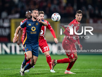 Bryan Cristante of AS Roma and Daniel Maldini of AC Monza play during the Serie A match between Monza and AS Roma at U-Power Stadium in Monz...