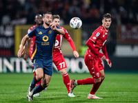 Bryan Cristante of AS Roma and Daniel Maldini of AC Monza play during the Serie A match between Monza and AS Roma at U-Power Stadium in Monz...