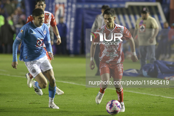 Carlos Varga #26 of Cruz Azul and Brayan Garnica #15 of Club Necaxa battle for the ball during the 11th round match of the Torneo de Apertur...