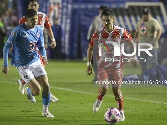 Carlos Varga #26 of Cruz Azul and Brayan Garnica #15 of Club Necaxa battle for the ball during the 11th round match of the Torneo de Apertur...