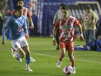 Carlos Varga #26 of Cruz Azul and Brayan Garnica #15 of Club Necaxa battle for the ball during the 11th round match of the Torneo de Apertur...