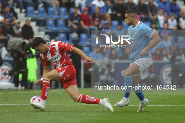 Willer Ditta #4 of Cruz Azul and Jose Paradela #10 of Club Necaxa battle for the ball during the 11th round match of the Torneo de Apertura...