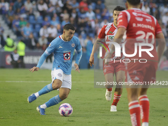 Erik Lira #6 of Cruz Azul drives the ball forward during the 11th round match of the Torneo de Apertura 2024 as part of the Liga MX between...