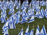 Hundreds of Israeli flags are outside a synagogue as Jews mark the one-year anniversary of the October 7th attack that sparks the Israel-Ham...