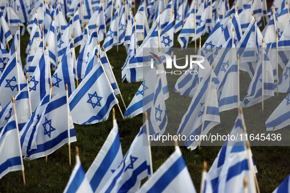 Hundreds of Israeli flags are outside a synagogue as Jews mark the one-year anniversary of the October 7th attack that sparks the Israel-Ham...