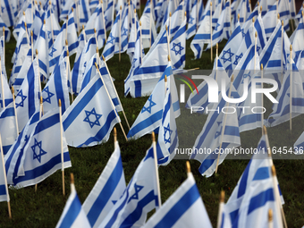 Hundreds of Israeli flags are outside a synagogue as Jews mark the one-year anniversary of the October 7th attack that sparks the Israel-Ham...