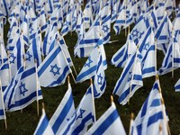 Hundreds of Israeli flags are outside a synagogue as Jews mark the one-year anniversary of the October 7th attack that sparks the Israel-Ham...