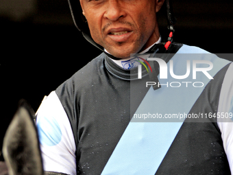 Jockey Patrick Husbands leaves the paddock ahead of the third race at Woodbine Racetrack in Toronto, Canada, on October 6, 2024. (