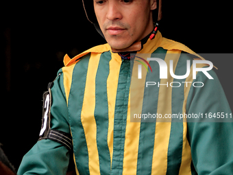 Jockey Eswan Flores leaves the paddock ahead of the third race at Woodbine Racetrack in Toronto, Canada, on October 6, 2024. (