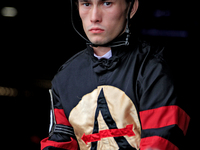 Jockey Fraser Aebly leaves the paddock ahead of the third race at Woodbine Racetrack in Toronto, Canada, on October 6, 2024. (