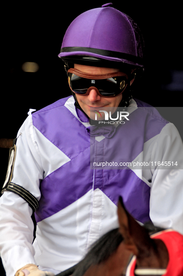 Jockey David Moran leaves the paddock ahead of the third race at Woodbine Racetrack in Toronto, Canada, on October 6, 2024. 