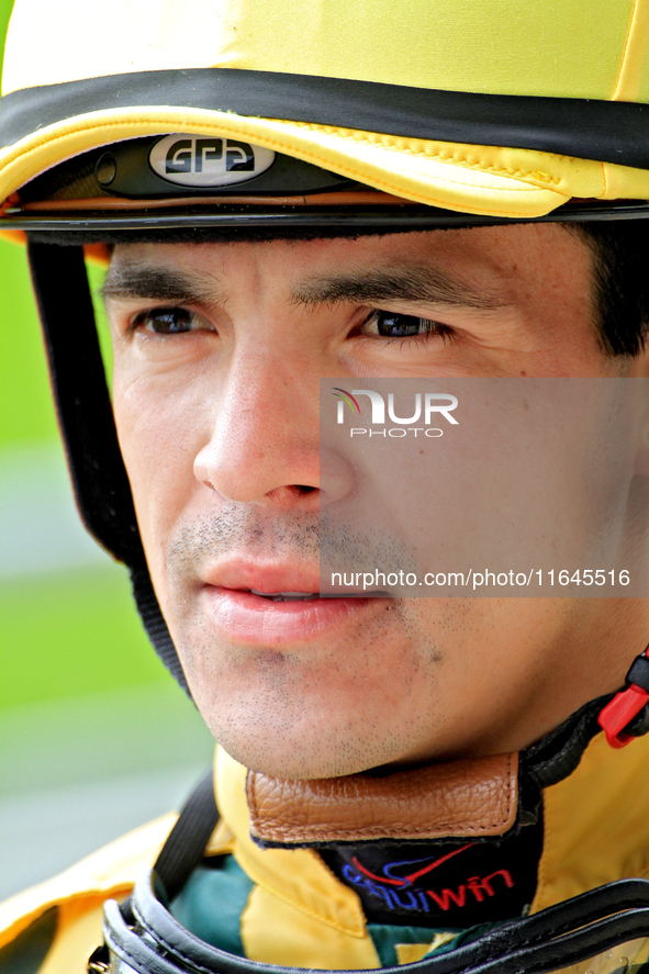 Jockey Eswan Flores speaks to connections following the third race at Woodbine Racetrack in Toronto, Canada, on October 6, 2024. 