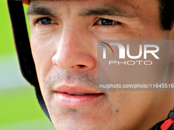 Jockey Eswan Flores speaks to connections following the third race at Woodbine Racetrack in Toronto, Canada, on October 6, 2024. (