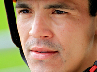 Jockey Eswan Flores speaks to connections following the third race at Woodbine Racetrack in Toronto, Canada, on October 6, 2024. (