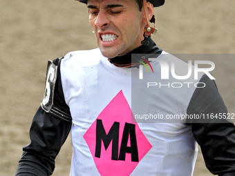 Jockey Leo Salles grimaces following a race at Woodbine Racetrack in Toronto, Canada, on October 6, 2024. (