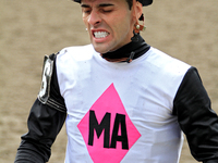 Jockey Leo Salles grimaces following a race at Woodbine Racetrack in Toronto, Canada, on October 6, 2024. (