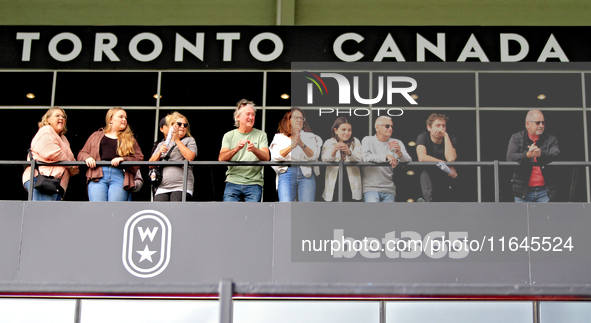 Spectators gather along the grandstand rail to watch a race at Woodbine Racetrack in Toronto, Canada, on October 6, 2024. 