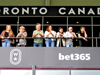 Spectators gather along the grandstand rail to watch a race at Woodbine Racetrack in Toronto, Canada, on October 6, 2024. (