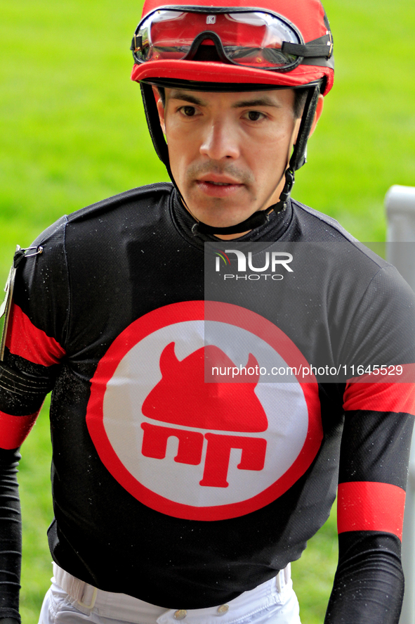 Jockey Eswan Flores leaves the winner's circle after riding Shadow Realm to a win in the fifth race at Woodbine Racetrack in Toronto, Canada...