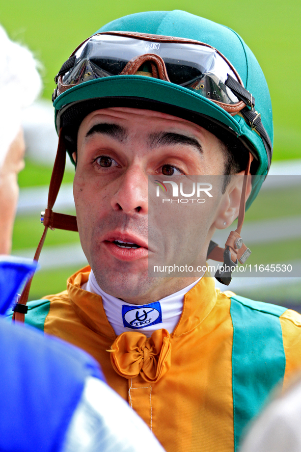 Jockey Leo Salles speaks with connections following the fifth race at Woodbine Racetrack in Toronto, Canada, on October 6, 2024. 